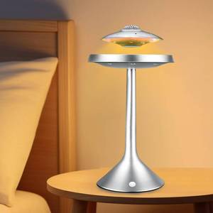 lot 1458 image: Magnetic Levitation Bluetooth UFO Speaker, Levitating UFO Speakers with Seven Color Night Lamp, Wireless Charging LED Lamp Bluetooth Speaker, 360°Rotating UFO Lamp (Silver) - Retail $136