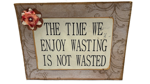 lot 6870 image: Decorative Wall Sign The Time We Enjoy Wasting Is Not Wasted