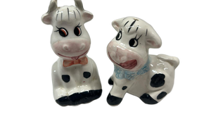 lot 7044 image: Pair of vintage Cow-Shaped Ceramic Salt and Pepper Shakers with Stoppers
