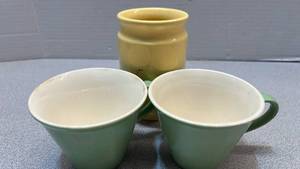 lot 7814 image: Three ceramic pieces  - two green mugs with handles, one yellow jar