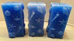 lot 7834 image: Blue Pillar Candles with Sea Shells and Starfish Embeds Set of 3