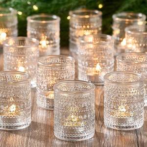 lot 58677 image: 24 Pack Clear Glass Votive Candle Holders, Vintage Candle Holder for Floating Candle, Tealight Candle Holder for Table Centerpieces Home Bridal Shower Birthday Christmas Wedding Party Table Decoration - Retail $17