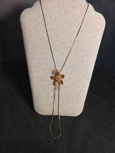 lot 6397 image: Gold Tone Flower Lariat Necklace with Decorative Leaf and Spiral Pendant