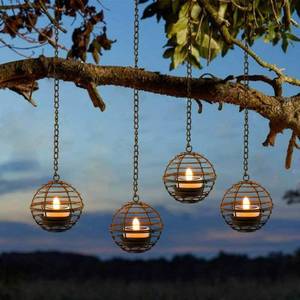 lot 828 image: Solar Hanging Lanterns Outdoor Waterproof, Rust Iron Ball Candle Holder with Flickering Solar Powered Tea Lights, Perfect Chargeable Solar Lights for Backyard Patio Garden Fence Tree Decoration-4Pack - Retail $29