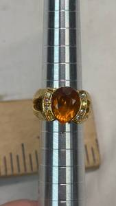 lot 15 image: Ring with Amber Center Stone and Decorative Accents