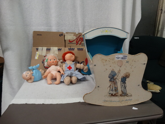 lot 1594 image: Vintage Holly Hobbie Hooded Rocking Doll Cradle w misc. Dolls