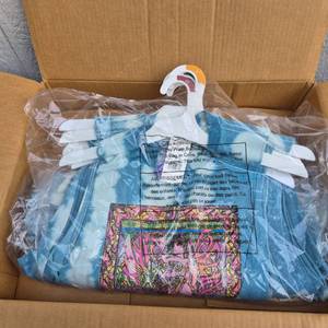 lot 313 image: Lot of 9 Mixed Sizes Tie Dye Janis Joplin Sleeveless Womens Shirts with Hangers  - Retail $0