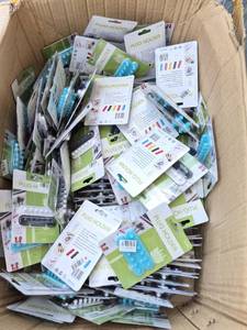 lot 191 image: BOX FULL OF MORE THAN 100 - ALL FACTORY SEALED - Plug Holder Cable Organizer Lot Multiple Units CC-595 - Retail $0