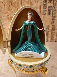 lot 214 image: Decorative Egg with Doll Figure Music Box Trinket - Retail $0