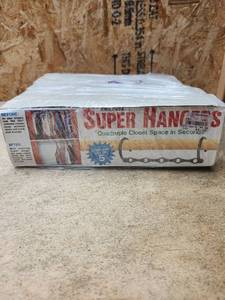 lot 215 image: Super Hangers Quadruple Closet Space in Seconds Complete Set of 3 - Retail $0