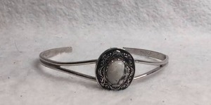 lot 3008 image: Silver Cuff Bracelet with Oval Stone Center and Ornamental Setting