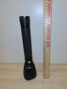 lot 31 image: Black LED Flashlight with Green Power Button Approximately 10 Inches