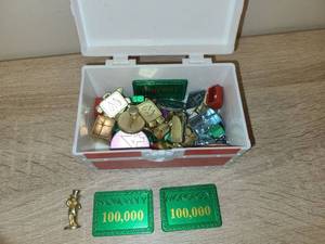 lot 142 image: Monopoly Game Pieces and Accessories Lot with Storage Container