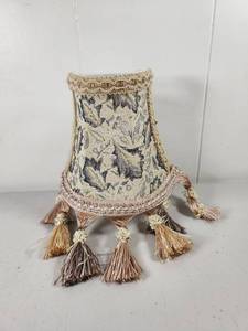 lot 148 image: Decorative Fabric Lamp Shade with Tassel Trim and Candelabra Plug In Wall Light