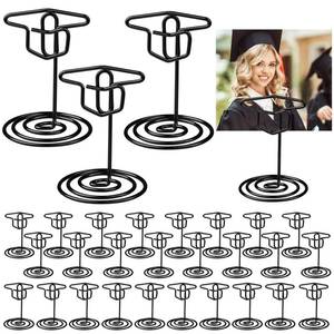lot 1766 image: Quuhooki 30 Pcs Graduation Picture Display 2 Inch Black Grad Cap Photo Holders for Centerpieces Graduation Cap Decorations Table Number Card Holders for Class of 2026 Grad Party supplies(Black) - Retail $14