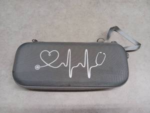 lot 428 image: Stethoscope with Medical Reference Guide Carrying Case