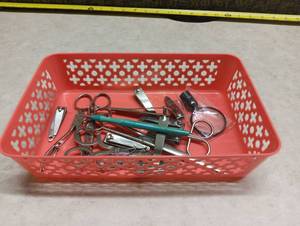 lot 503 image: Lot of Nail Care Grooming Tools Clippers Scissors in Red Basket