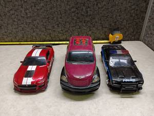 lot 557 image: Lot of 3 Die Cast Model Cars Red Mustang Police Sedan Chrysler