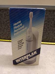 lot 583 image: Interplak Bausch & Lomb Home Plaque Removal Instrument.