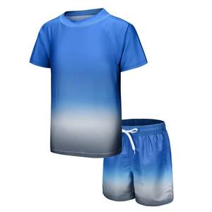lot 17691 image: Moon Tree Boys Rash Guard Set for Boys 2 Piece Swimsuits Short Sleeve Bathing Suits with Trunks Quick Dry Swim Shirts Blue Gray Gradient Size 7 - Retail $26