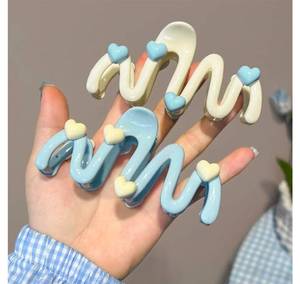 lot 15414 image: Hair Clips Package Of Two with Heart Charms Blue and Cream