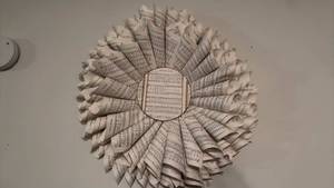 lot 919 image: Sheet music wall decor 24 inch dia located in basement