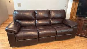 Leather power sofa dual reclining, wall hugger with adjustable head rest 36x 86x36 seat 19 inches