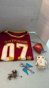 lot 1099 image: Harry Potter Gryffindor 07 T-Shirt 2XL with Collectibles Bundle dogs mouth needs repaired