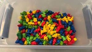 lot 1111 image: Small Animal-Shaped Plastic Sorting Figures Lot in Storage Bin