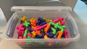 lot 1123 image: Plastic Pipe Building Construction Toys Assorted Colors Storage Container