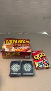 lot 1127 image: Movies Trivia Game, UNO Card Game, Water Lantern Festival Playing Cards Lot