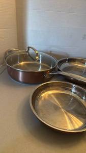 lot 1203 image: Cuisinart Model Induction Ready Cookware Set largest is 3qt