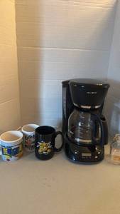 lot 1210 image: Mr. Coffee 12-Cup Drip Coffee Maker with coffee cups and small milk glass