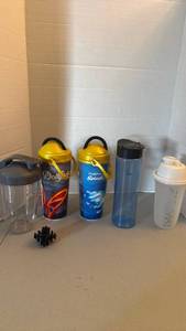 lot 1215 image: Dollywood and other cups with shaker