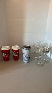 lot 1245 image: Starbucks 2 Red Holiday Cups, Teachers Plant Seeds tumblers, 3 Glass Wine Glasses