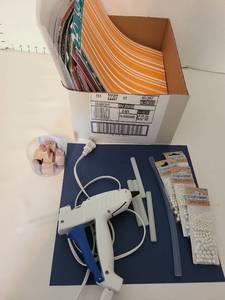 lot 1406 image: Scrapbook paper, glue gun, rubber stamps, beads