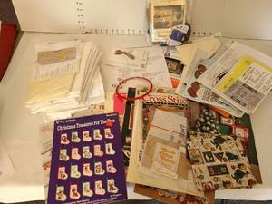 lot 1429 image: Large lot cross stitch patterns and aida cloth.