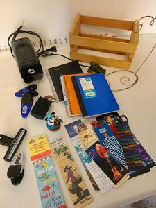 lot 1442 image: Electric pencil sharpener, book light,  composition books, bookmarks, small wood box, more.