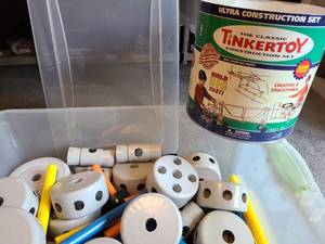 lot 1482 image: Large Sterilite tote with large plastic Tinker Toys and an empty Tinker Toy tin can