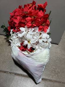 lot 3008 image: Bag of red and white poinsettias.