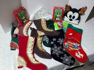lot 3010 image: Christmas stockings, Buddy Elf Christmas cards, Mickey Mouse reindeer hat