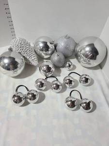 lot 3025 image: Large silver tone Christmas ornaments.