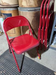lot 3044 image: Four red metal folding chairs