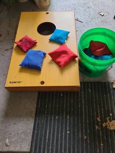 lot 3068 image: Corn hole game with bean bags in Menards bucket.
