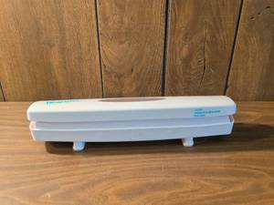 lot 27 image: Wraptastic Food Wrap Dispenser with Concealed Blade