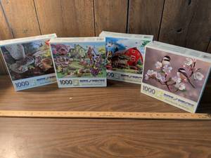 lot 66 image: Bits and Pieces 1000 Piece Jigsaw Puzzles Lot of 4