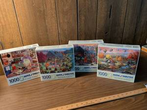 lot 74 image: Bits and Pieces 1000 Piece Jigsaw Puzzles Lot of 4