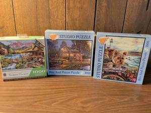 lot 88 image: Lot of 3 Jigsaw Puzzles 1000 Pieces Studio Puzzle Bits and Pieces Richard Macneil