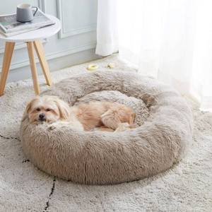 lot 5497 image: Calming Dog Bed & Cat Bed, Anti-Anxiety Donut Cuddler Warming Cozy Soft Round Fluffy Faux Fur Plush Cushion Bed for Small Medium Dogs and Cats (20242730)