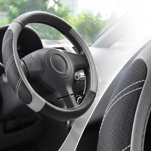 lot 28134 image: Steering Wheel Cover for 14.5 to 15 Wheels, Soft Padded Grip with Anti-Slip Inner Lining, Breathable Comfort for Daily Driving, Easy Stretch Fit for Cars, SUVs and Trucks, BlackGray - Retail $13